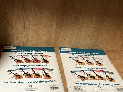 Alfred's Basic Guitar Method 1 and 2 by Alfred d'Auberge; Morton Manus 1990 & 92