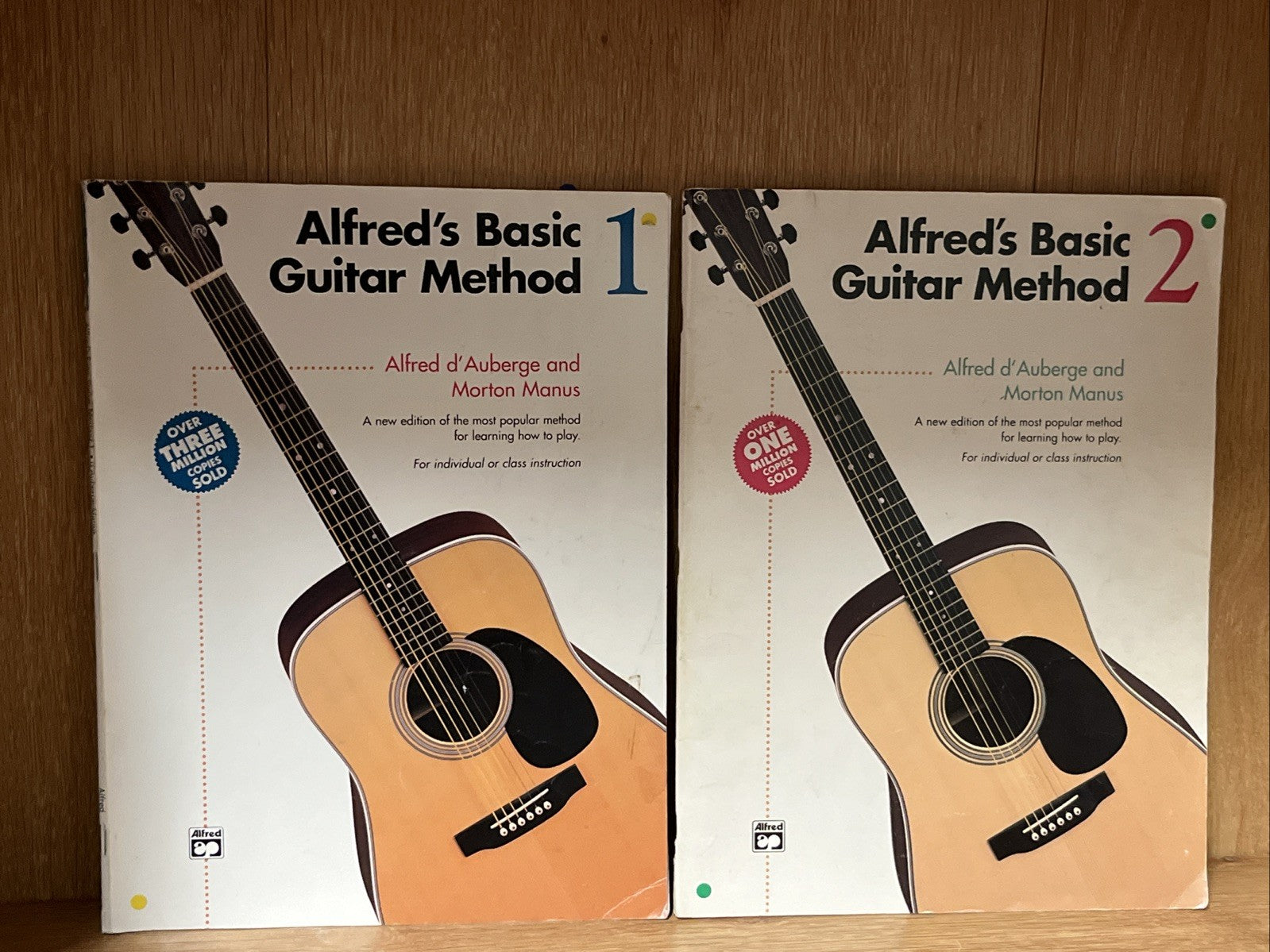 Alfred's Basic Guitar Method 1 and 2 by Alfred d'Auberge; Morton Manus 1990 & 92