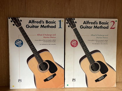 Alfred's Basic Guitar Method 1 and 2 by Alfred d'Auberge; Morton Manus 1990 & 92