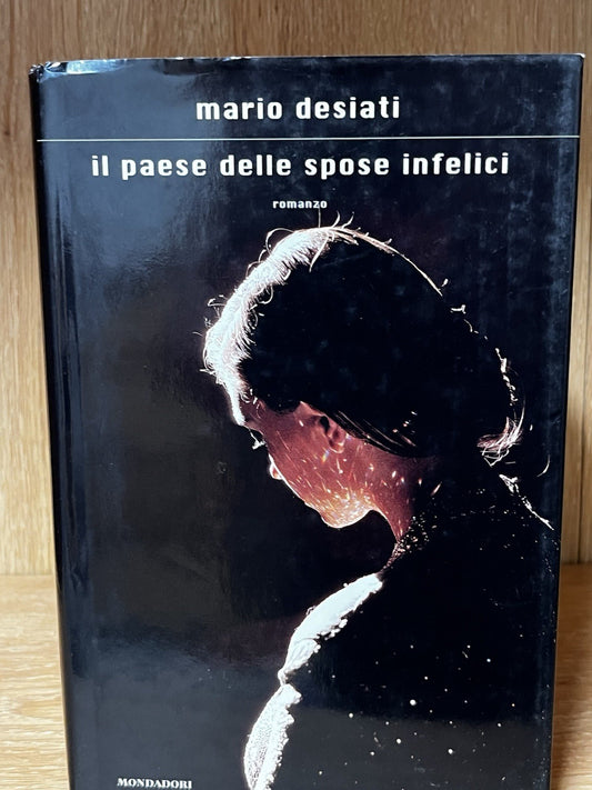 IL PAESE DELLE SPOSE INFELICI - Hardcover ( Italian) **Very Good Condition**